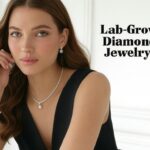 An image of a woman wearing Ouros Jewels Fine Lab-Grown Diamond Jewelry, including a tennis bracelet, earrings, a necklace, and a ring.